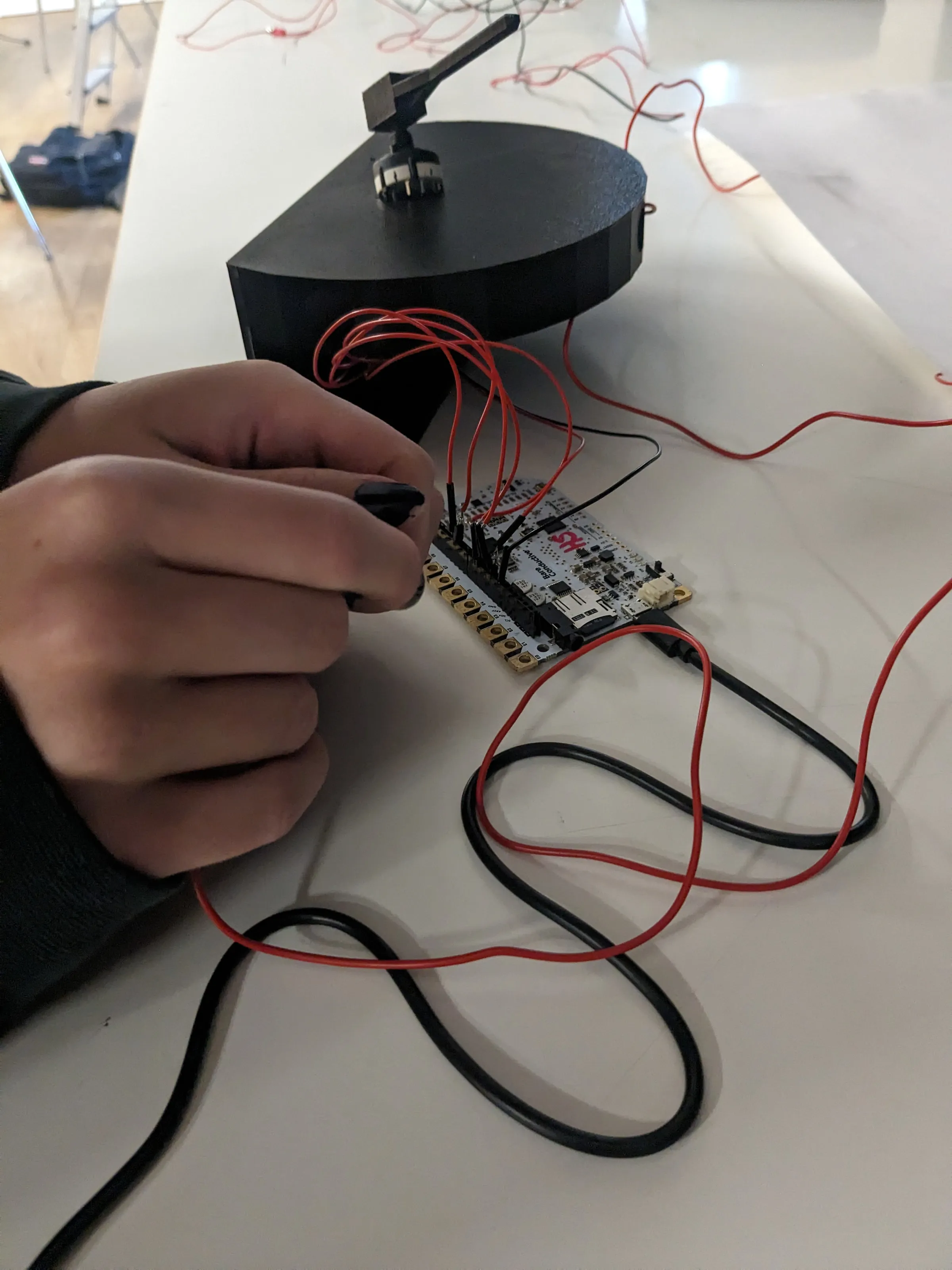 Close-up of jumper wires being plugged into the Bare Conductive Touch Board.