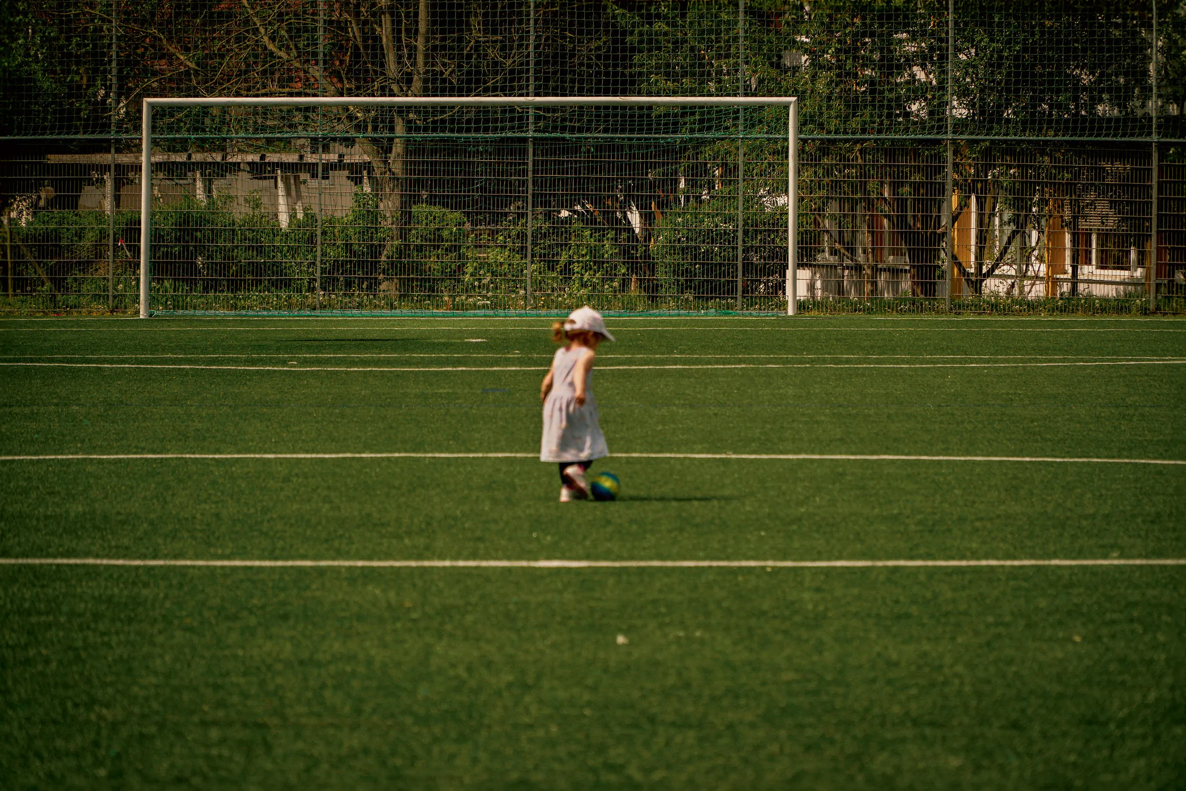 Girl walking on football field