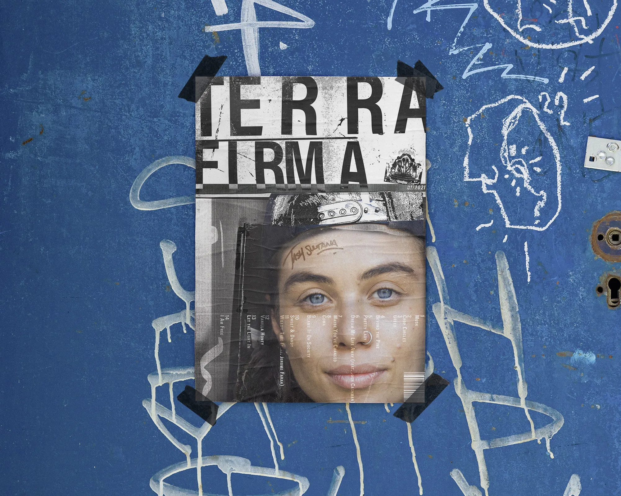 A poster taped to a blue graffiti wall: the coarsely screened title 'Terra Firma' above a portrait, the album's track list running down the side.