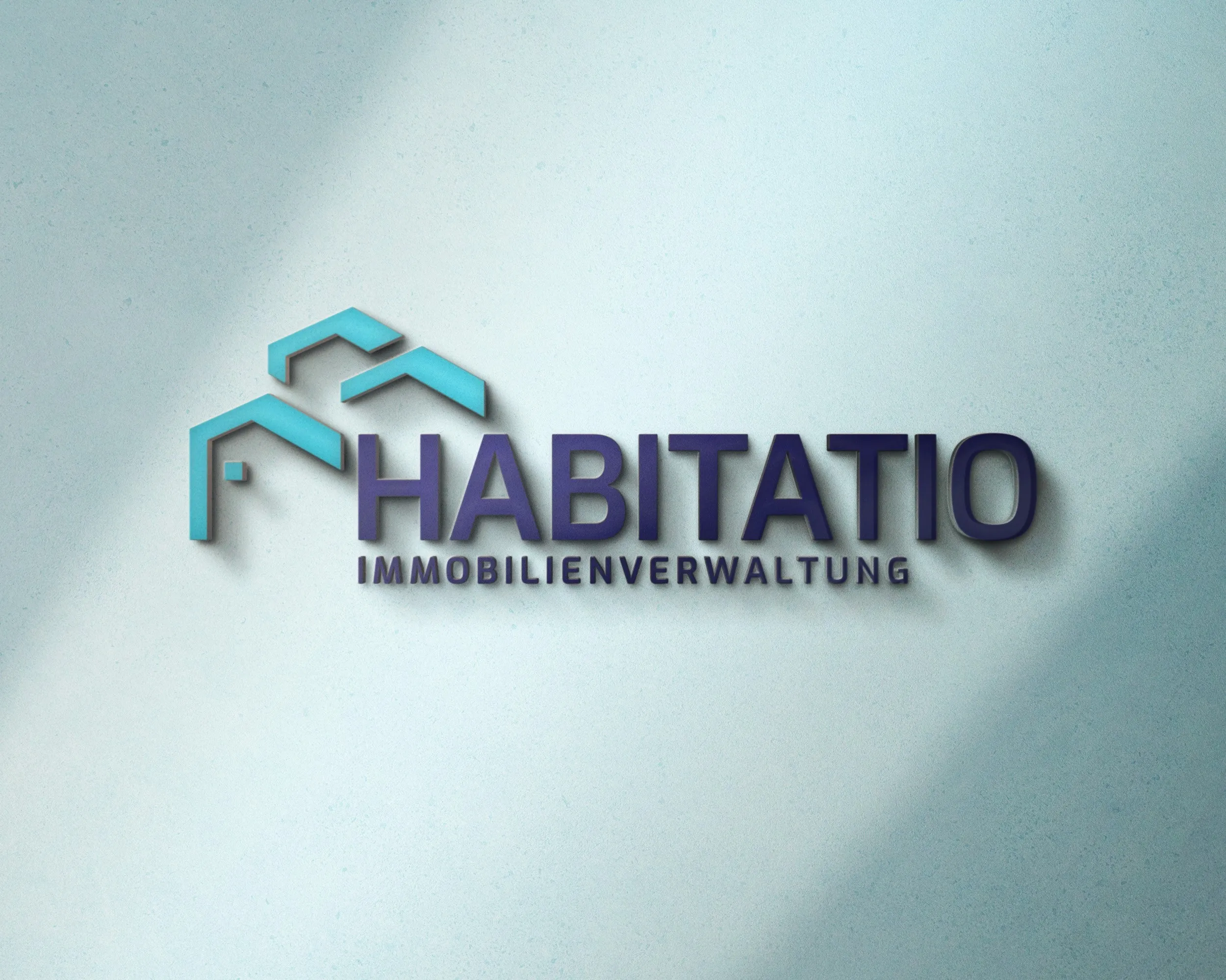 The 'Habitatio Immobilienverwaltung' logo as wall signage: two turquoise roof lines beside a dark blue wordmark in capitals.